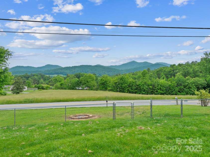 618 Enka Lake Road, Candler, NC 28715.  MLS# CAR4260345, YatesRealty ID 15064. Fenced in yard