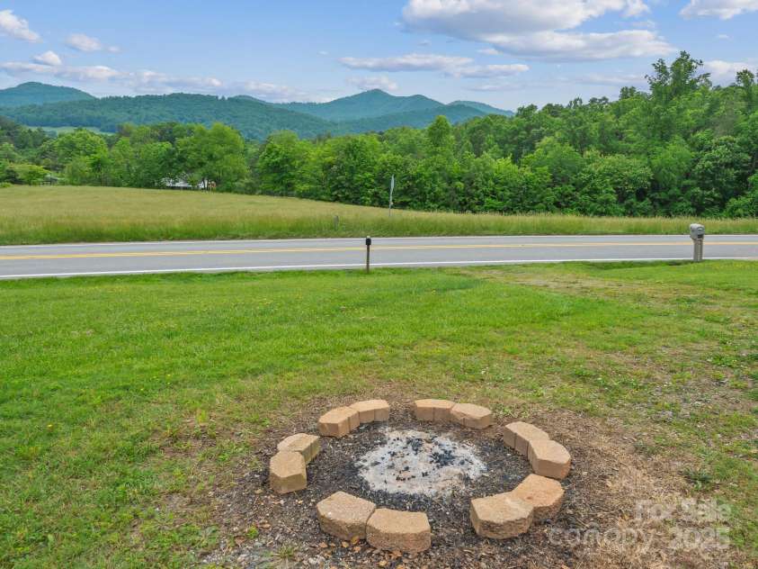 618 Enka Lake Road, Candler, NC 28715.  MLS# CAR4260345, YatesRealty ID 15064. Fire pit