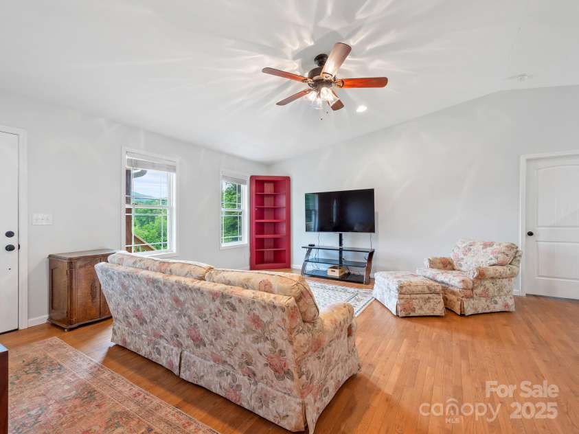 618 Enka Lake Road, Candler, NC 28715.  MLS# CAR4260345, YatesRealty ID 15064. Living Room with Cathedral Ceilings