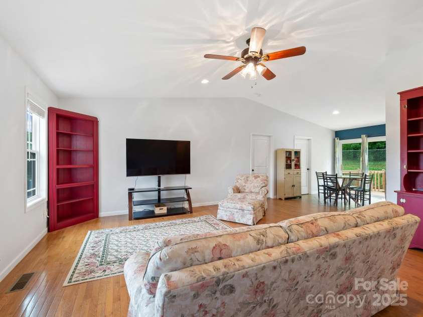 618 Enka Lake Road, Candler, NC 28715.  MLS# CAR4260345, YatesRealty ID 15064. Open living into dining