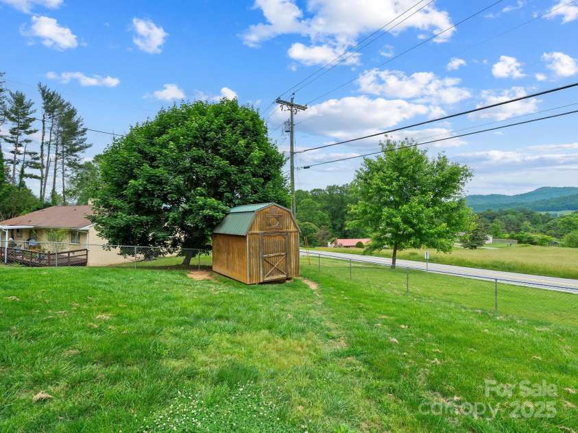 618 Enka Lake Road, Candler, NC 28715.  MLS# CAR4260345, YatesRealty ID 15064. Storage shed