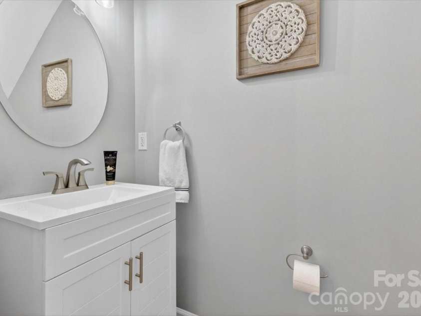 226 Dawn Mist Lane, Fort Mill, SC 29708.  MLS# CAR4369193, YatesRealty ID 15066. Half bath on main floor with an updated vanity 