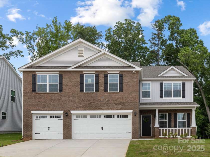 8024 Kennesaw Drive, Gastonia, NC 28056.  MLS# CAR4212004, YatesRealty ID 15069. Front View of Home, beautiful and private homesite!