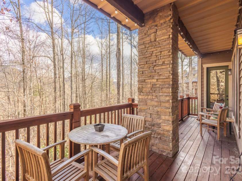 150 Saddle Notch Lane, Tuckasegee, NC 28783.  MLS# CAR4205859, YatesRealty ID 15074. Full Length back porch 