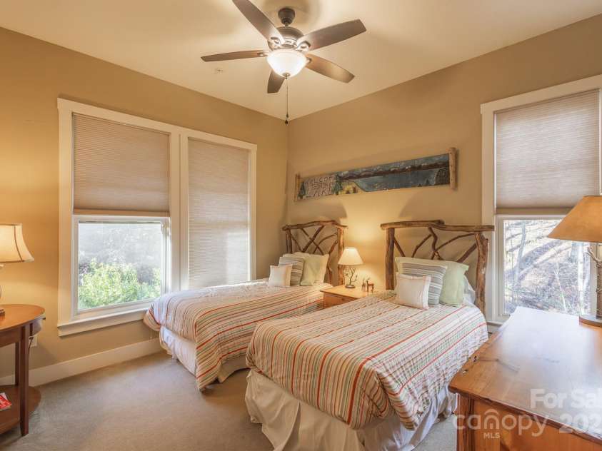 150 Saddle Notch Lane, Tuckasegee, NC 28783.  MLS# CAR4205859, YatesRealty ID 15074. Lots of windows