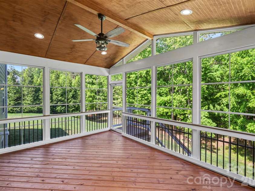 824 Abbeywood Drive, Waxhaw, NC 28173.  MLS# CAR4372119, YatesRealty ID 15074. Beautifully appointed enclosed rear porch for additional outdoor entertaining or relaxing!