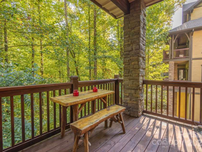 150-2 Saddle Notch Lane, Tuckasegee, NC 28783.  MLS# CAR4181029, YatesRealty ID 15075. Eating area on porch