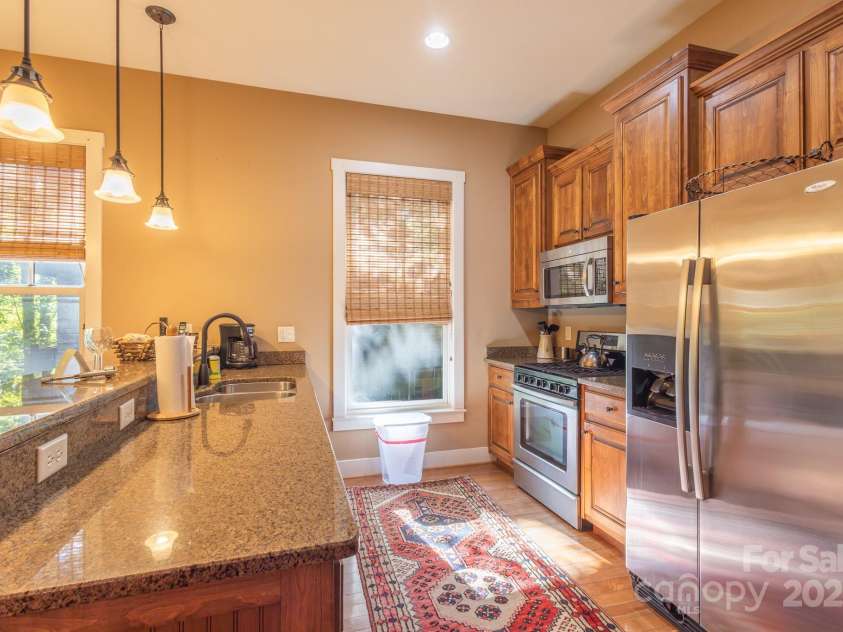 150-2 Saddle Notch Lane, Tuckasegee, NC 28783.  MLS# CAR4181029, YatesRealty ID 15075. Fully equipped Kitchen with granite counter tops and bar