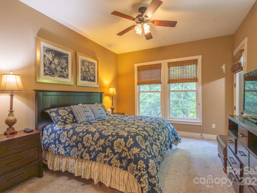 150-2 Saddle Notch Lane, Tuckasegee, NC 28783.  MLS# CAR4181029, YatesRealty ID 15075. Mater Bedroom overlooks forest through double windows