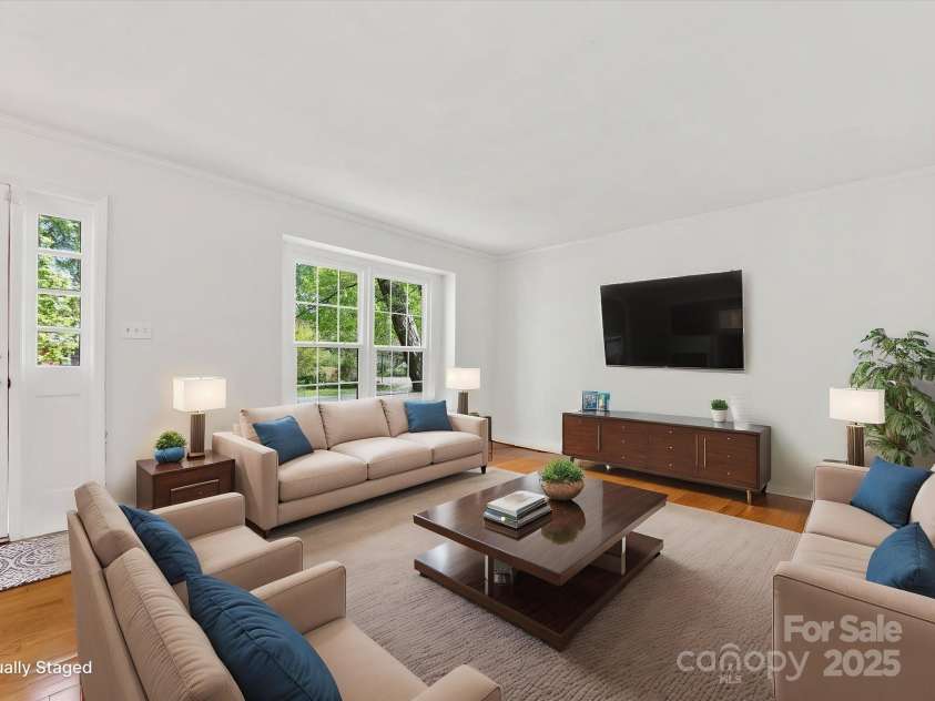 5114 Glenbrier Drive, Charlotte, NC 28212.  MLS# CAR4238590, YatesRealty ID 15076. Living room with large windows