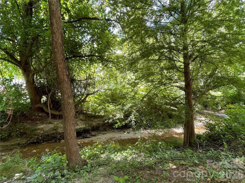 475 Church Street, Hendersonville, NC 28792.  MLS# CAR4392602, YatesRealty ID 15078. Babbling Stream