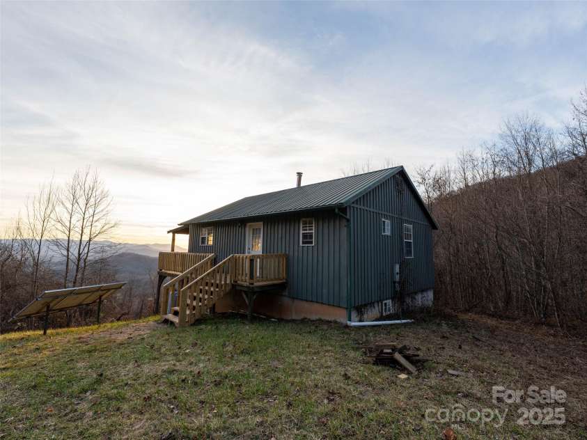 506 Rocky Acres Road, Canton, NC 28716.  MLS# CAR4327605, YatesRealty ID 1508. Off grid cabin with roughly 770 sq ft and another roughly 770 unheated in the basement! 