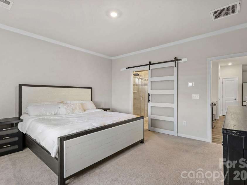 6499 Gopher Road, Lancaster, SC 29720.  MLS# CAR4429310, YatesRealty ID 15080. Main level primary bedroom