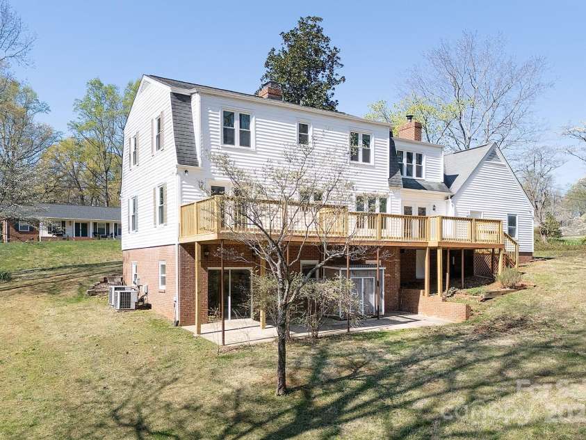 916 Rollingwood Drive, Mount Holly, NC 28120.  MLS# CAR4241352, YatesRealty ID 15080. Back Exterior View Huge Deck Resurfaced 2024