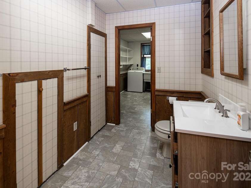 916 Rollingwood Drive, Mount Holly, NC 28120.  MLS# CAR4241352, YatesRealty ID 15080. Basement Half Bath New Flooring May 2025