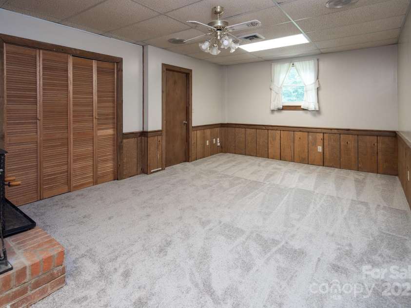 916 Rollingwood Drive, Mount Holly, NC 28120.  MLS# CAR4241352, YatesRealty ID 15080. Basement New Carpet May 2025