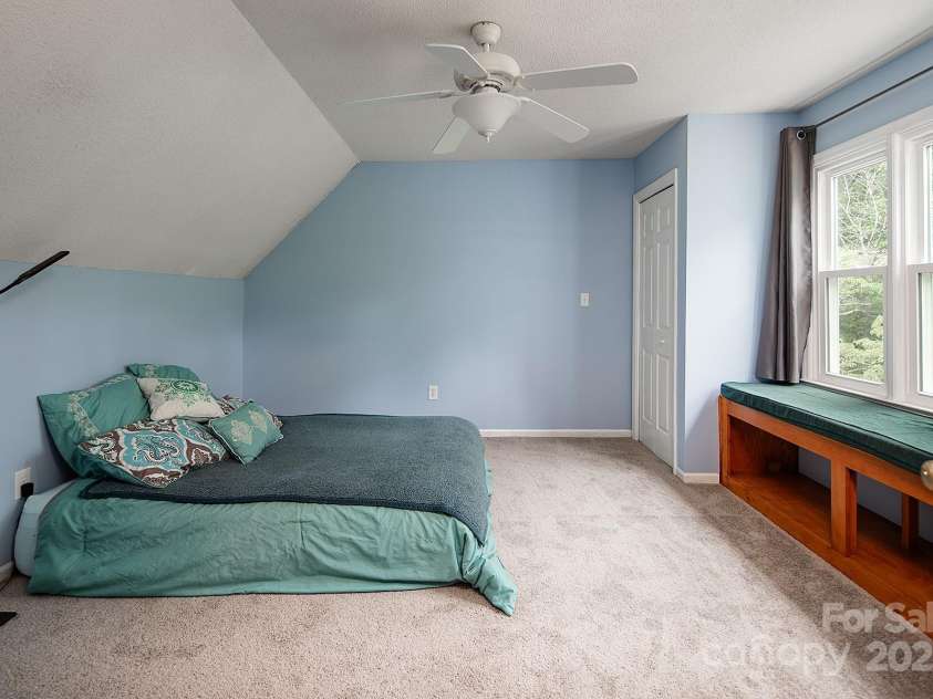 916 Rollingwood Drive, Mount Holly, NC 28120.  MLS# CAR4241352, YatesRealty ID 15080. Bedroom 2 New Carpet May 2025 Charming Window seat overlooks huge backyard Two Closets