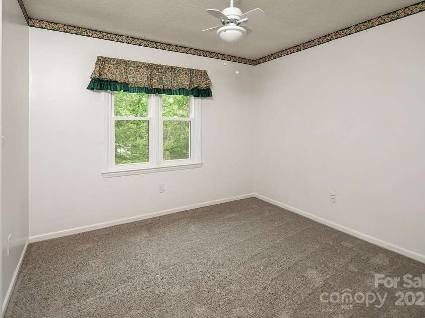 916 Rollingwood Drive, Mount Holly, NC 28120.  MLS# CAR4241352, YatesRealty ID 15080. Bedroom 3 New Carpet May 2025