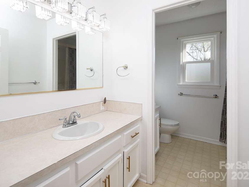 916 Rollingwood Drive, Mount Holly, NC 28120.  MLS# CAR4241352, YatesRealty ID 15080. Full Bath 2 fresh paint, lighting and cabinet hardware