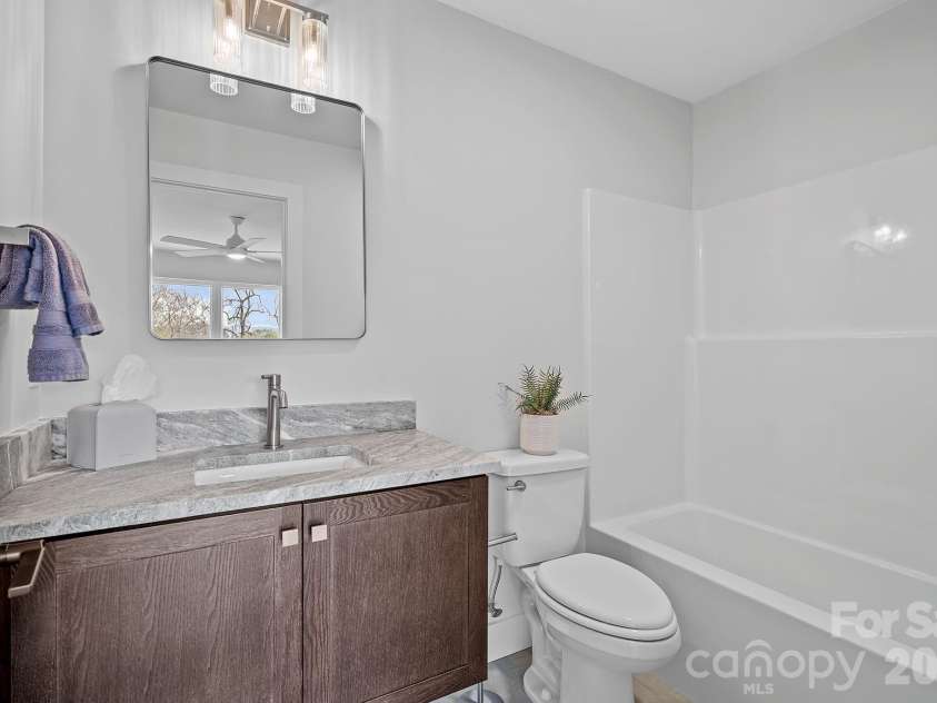 9 Gudger Road, Asheville, NC 28806.  MLS# CAR4406363, YatesRealty ID 15085. Bedroom 2 En Suite Bath