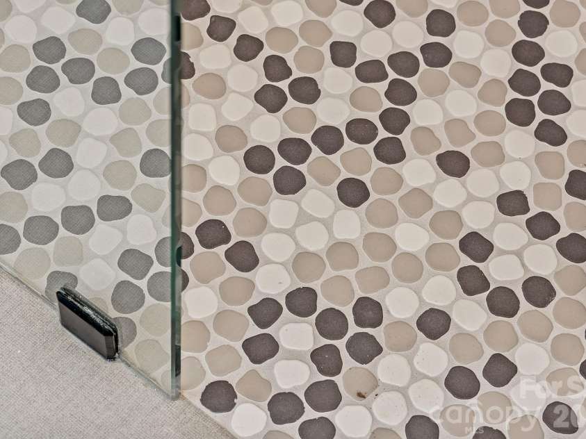 9 Gudger Road, Asheville, NC 28806.  MLS# CAR4406363, YatesRealty ID 15085. Custom Tiled Flooring in the Primary Shower