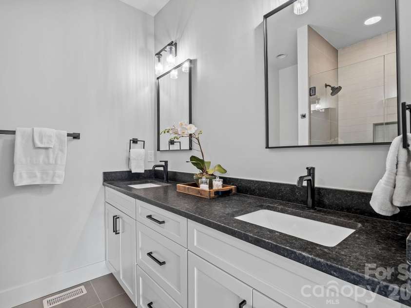 9 Gudger Road, Asheville, NC 28806.  MLS# CAR4406363, YatesRealty ID 15085. Dual Sinks in the Primary Suite