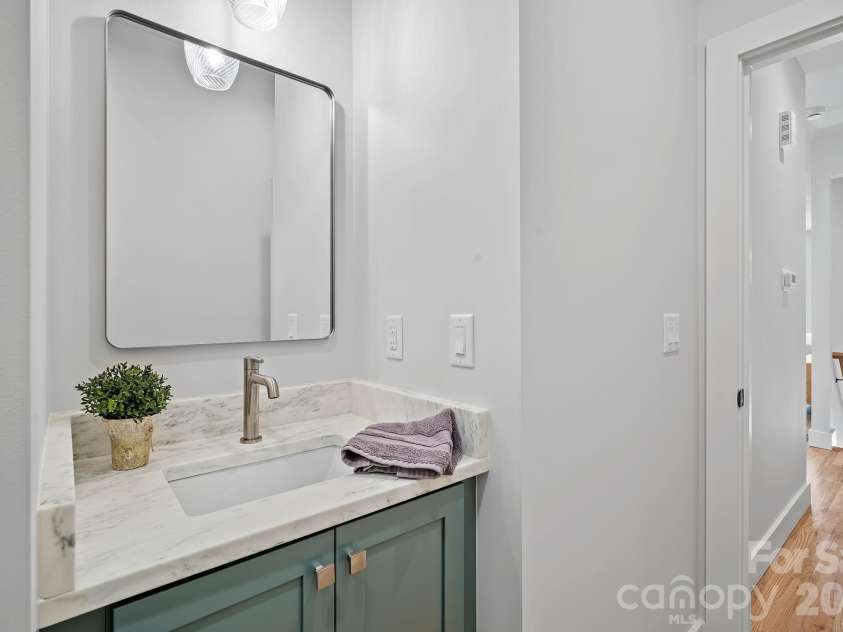 9 Gudger Road, Asheville, NC 28806.  MLS# CAR4406363, YatesRealty ID 15085. Powder Room on the Main Level