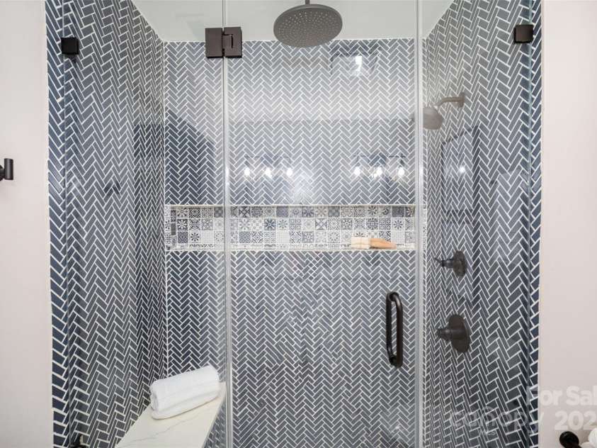 328 Earl Griffin Road, Monroe, NC 28112.  MLS# CAR4251037, YatesRealty ID 15093. Walk-in shower with custom tile & rainhead.
