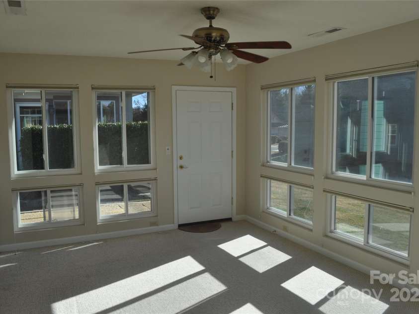 51 Barn Owl Way, Hendersonville, NC 28792.  MLS# CAR4328373, YatesRealty ID 1510. Bright Sunroom