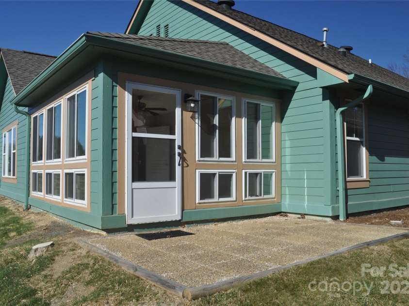 51 Barn Owl Way, Hendersonville, NC 28792.  MLS# CAR4328373, YatesRealty ID 1510. Patio off Sunroom