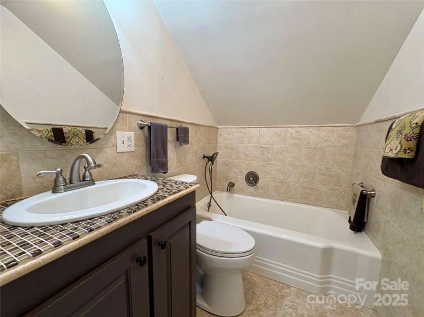 114 Broadway Avenue, Tryon, NC 28782.  MLS# CAR4322856, YatesRealty ID 15101. Upstairs there is a second full bath for the two additional bedrooms on that level.