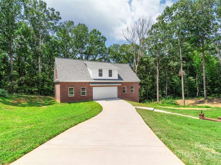 3009 Brooks Mill Lane, Wingate, NC 28174.  MLS# CAR4293288, YatesRealty ID 15104. Drive to the detached garage