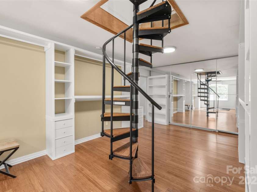 3009 Brooks Mill Lane, Wingate, NC 28174.  MLS# CAR4293288, YatesRealty ID 15104. Enter your private dressing room - The staircase entry was built to accommodate an elevator, should you wish.