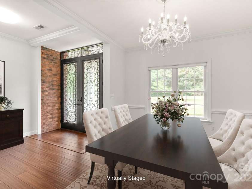 3009 Brooks Mill Lane, Wingate, NC 28174.  MLS# CAR4293288, YatesRealty ID 15104. Step through the detailed entry doors to a bright and welcoming space.  