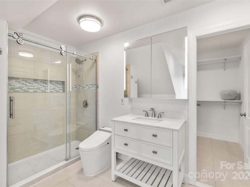 3009 Brooks Mill Lane, Wingate, NC 28174.  MLS# CAR4293288, YatesRealty ID 15104. Upstairs guest suite bath and walk-in closet