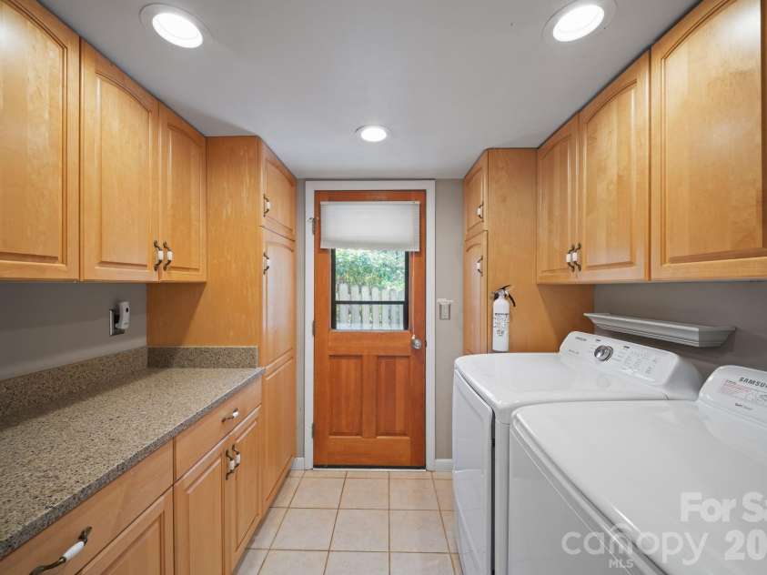 363 Sequoyah Lane, Brevard, NC 28712.  MLS# CAR4370995, YatesRealty ID 15106. Laundry room off kitchen