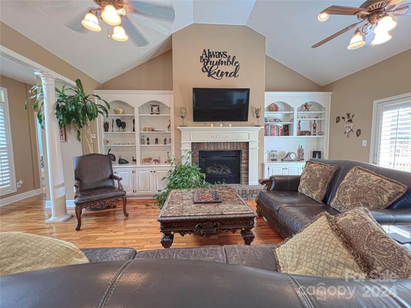 115 Anson Drive, China Grove, NC 28023.  MLS# CAR4146594, YatesRealty ID 1512. A Family Room 2nd to none, beautifully crafted built-ins for display of family keepsakes added to the comfort of gas logs in the fireplace for wintery nights of TV watching.