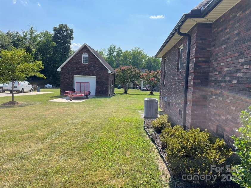 115 Anson Drive, China Grove, NC 28023.  MLS# CAR4146594, YatesRealty ID 1512. Detached garage to left and back of home