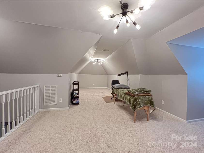 115 Anson Drive, China Grove, NC 28023.  MLS# CAR4146594, YatesRealty ID 1512. Family Room over garage - spacious for another bedroom, playroom, 2nd family room or office space