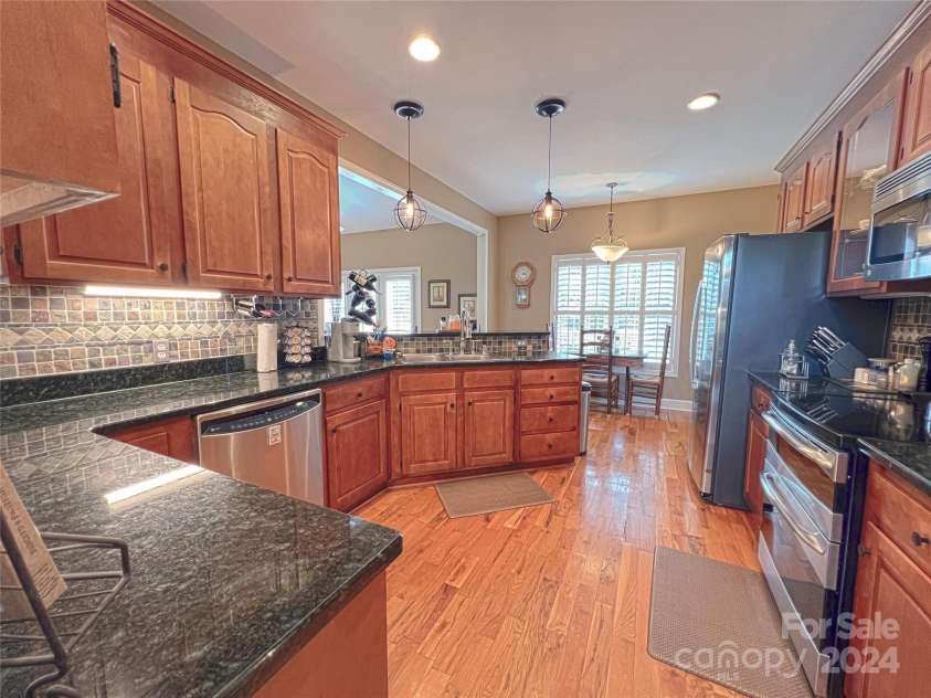 115 Anson Drive, China Grove, NC 28023.  MLS# CAR4146594, YatesRealty ID 1512. Kitchen includes prep space galore, easy acces to storage, breakfast nook and bar to seat two people confortably.