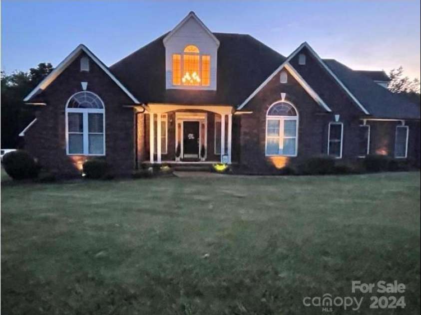 115 Anson Drive, China Grove, NC 28023.  MLS# CAR4146594, YatesRealty ID 1512. Outdoor lighting creates a serene sense of relaxation