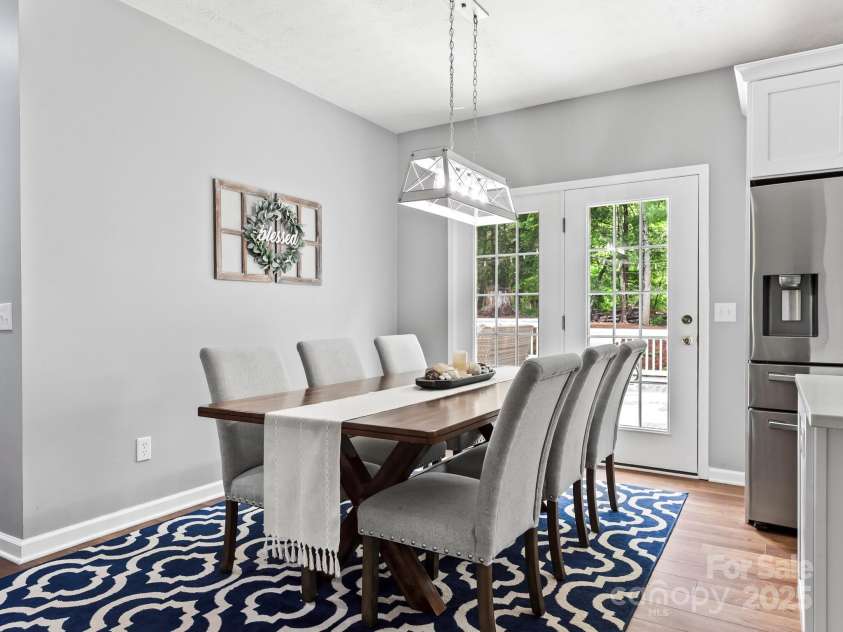 642 Bull Creek Road, Mars Hill, NC 28754.  MLS# CAR4260384, YatesRealty ID 15122. Looking from opening to the living room toward French doors leading out to a wonderfully appointed outdoor area perfect for entertaining!