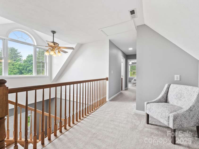 642 Bull Creek Road, Mars Hill, NC 28754.  MLS# CAR4260384, YatesRealty ID 15122. Sitting area over foyer between the two upstairs bedrooms and bonus room. The natural lighting is wonderful!