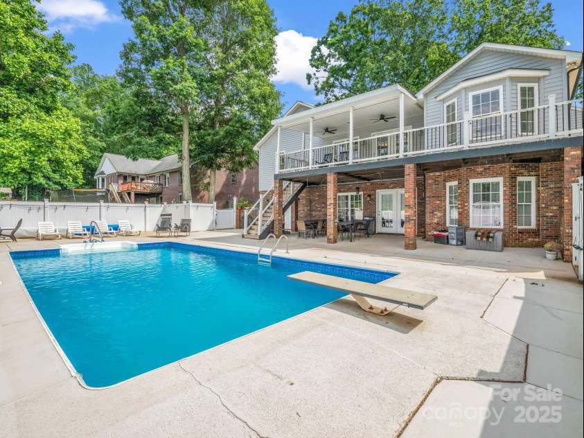 208 Wellington Drive, Lincolnton, NC 28092.  MLS# CAR4252739, YatesRealty ID 15128. Back view with pool