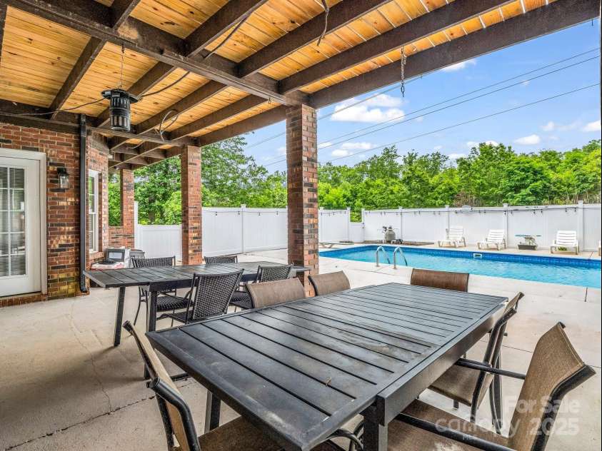 208 Wellington Drive, Lincolnton, NC 28092.  MLS# CAR4252739, YatesRealty ID 15128. Lower patio covered