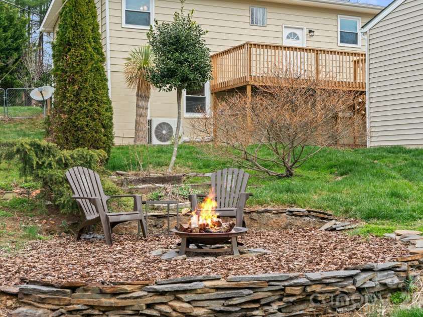 26 Cedar Hill Road, Asheville, NC 28806.  MLS# CAR4357706, YatesRealty ID 15128. Fire pit area in back yard.
