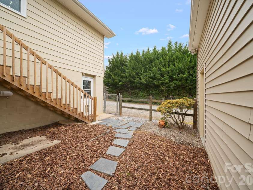 26 Cedar Hill Road, Asheville, NC 28806.  MLS# CAR4357706, YatesRealty ID 15128. Walkway leading into fully fenced back yard.