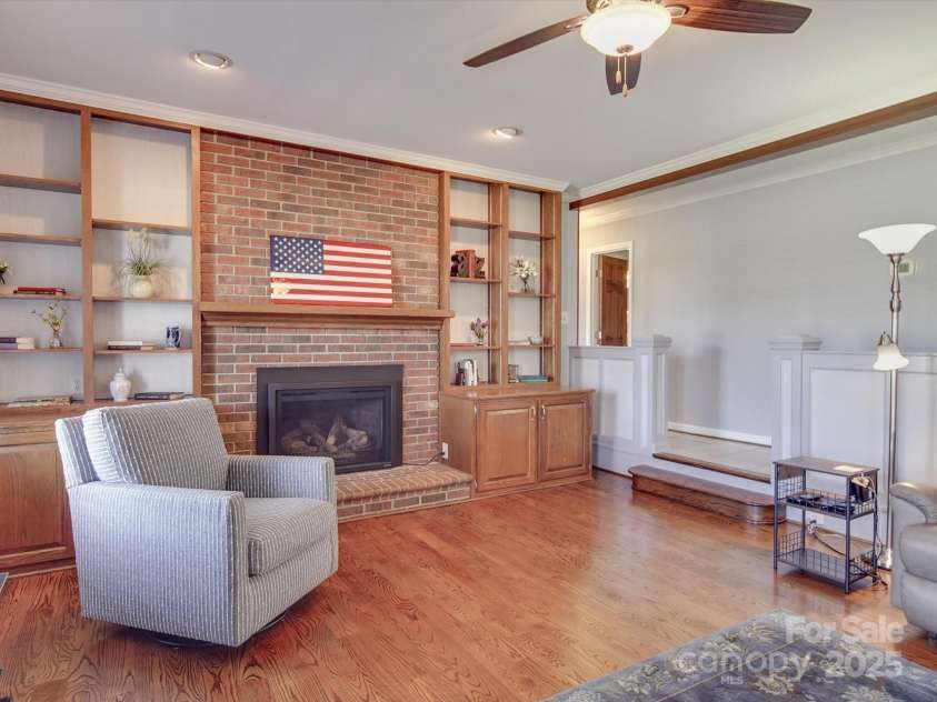 7169 Pleasant Grove Road, Charlotte, NC 28216.  MLS# CAR4214208, YatesRealty ID 15135. Family room w/ built in shelving