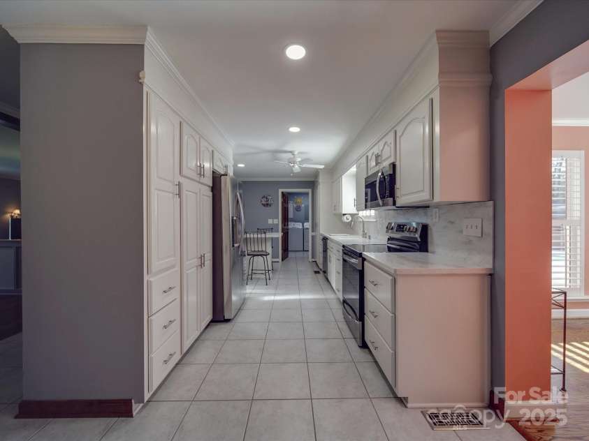 7169 Pleasant Grove Road, Charlotte, NC 28216.  MLS# CAR4214208, YatesRealty ID 15135. Galley kitchen