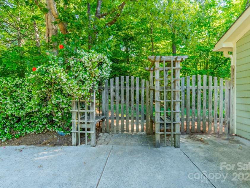 5232 Silchester Lane, Charlotte, NC 28215.  MLS# CAR4240756, YatesRealty ID 15138. Garage Side